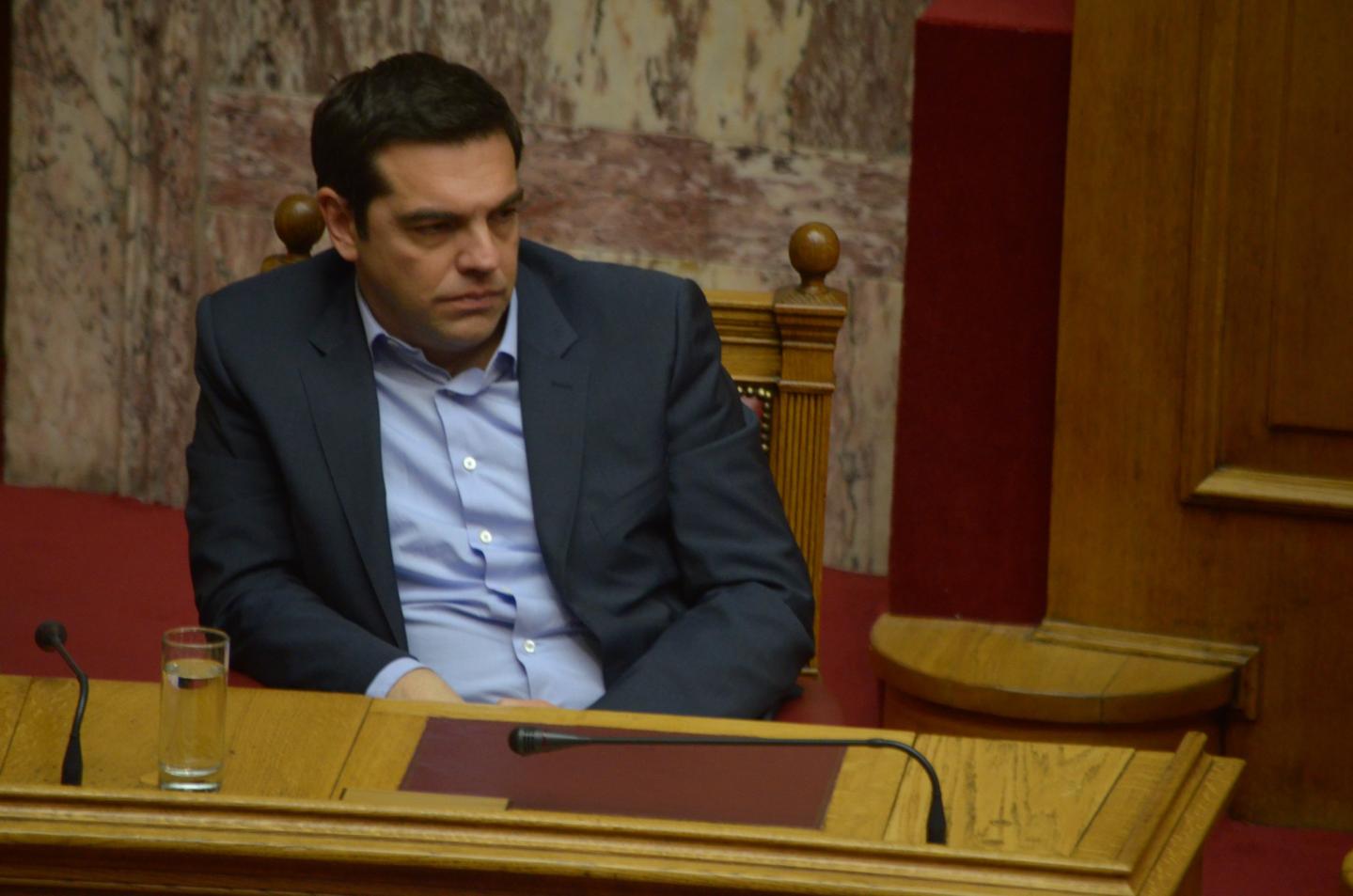 Prime Minister of Greece Aexis Tsipras sits in the Greek