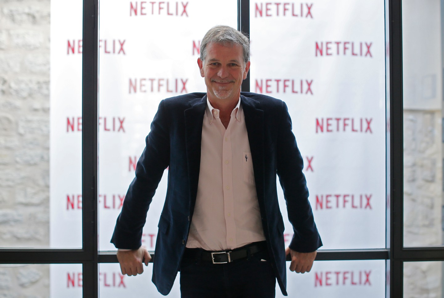 Reed Hastings, founder and CEO of Netflix, poses during an interview with Reuters in Paris