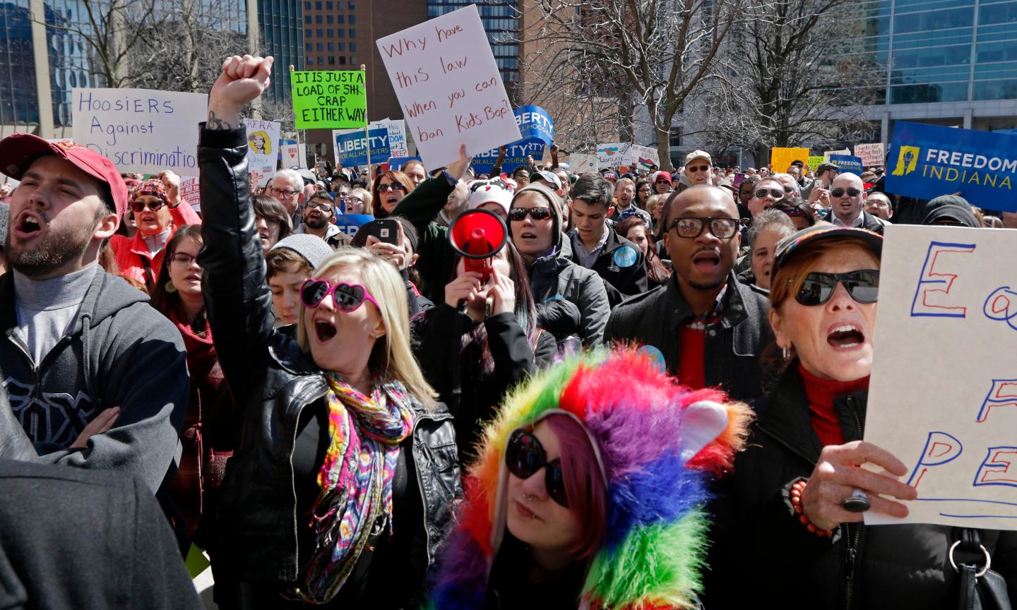 Demonstrators gather to protest a controversial religious freedom bill in Indianapolis