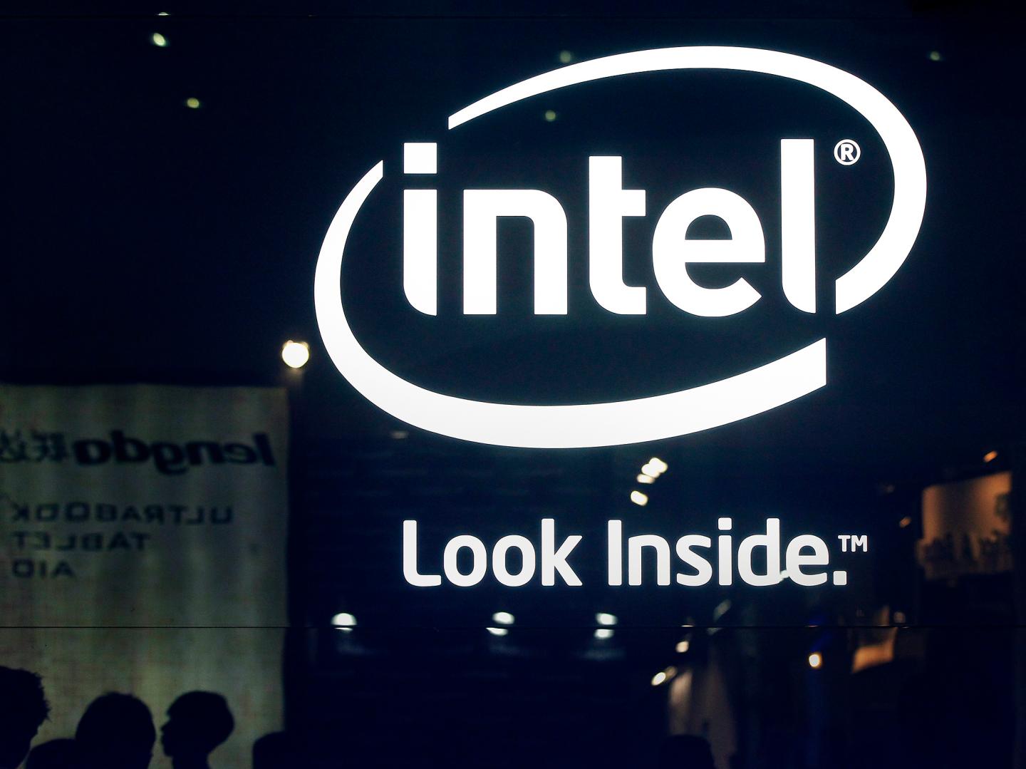 People visit the Intel booth at the 2013 Computex exhibition at the TWTC Nangang exhibition hall in Taipei