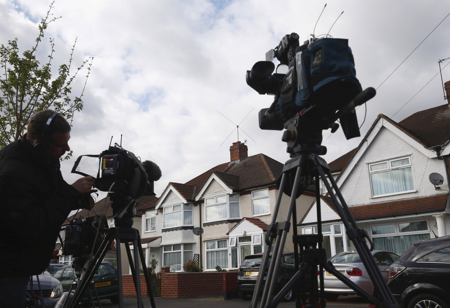 Television crews wait outside the address where Nav Sarao Futures Limited is registered, in Hounslow, London