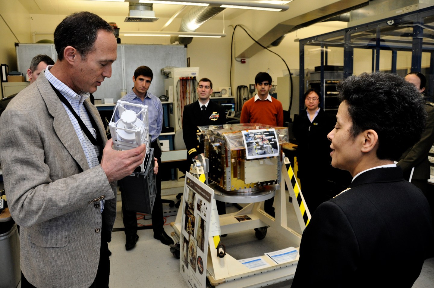150403-N-EE987-004 MONTEREY, Calif. (April 3, 2015) Vice Chief of Naval Operations (VCNO) Adm. Michelle J. Howard shares a handshake and a laugh with Dr. Rudy Panholzer, Space Systems Academic Group chair professor, during a visit to the Naval Postgraduate School (NPS). The NPS mission is to provide relevant and unique advanced education and research programs to increase the combat effectiveness of commissioned officers of the Naval Service to enhance the security of the United States. (U.S. Navy photo by Mass Communication Specialist 2nd Class Shawn J. Stewart/Released)
