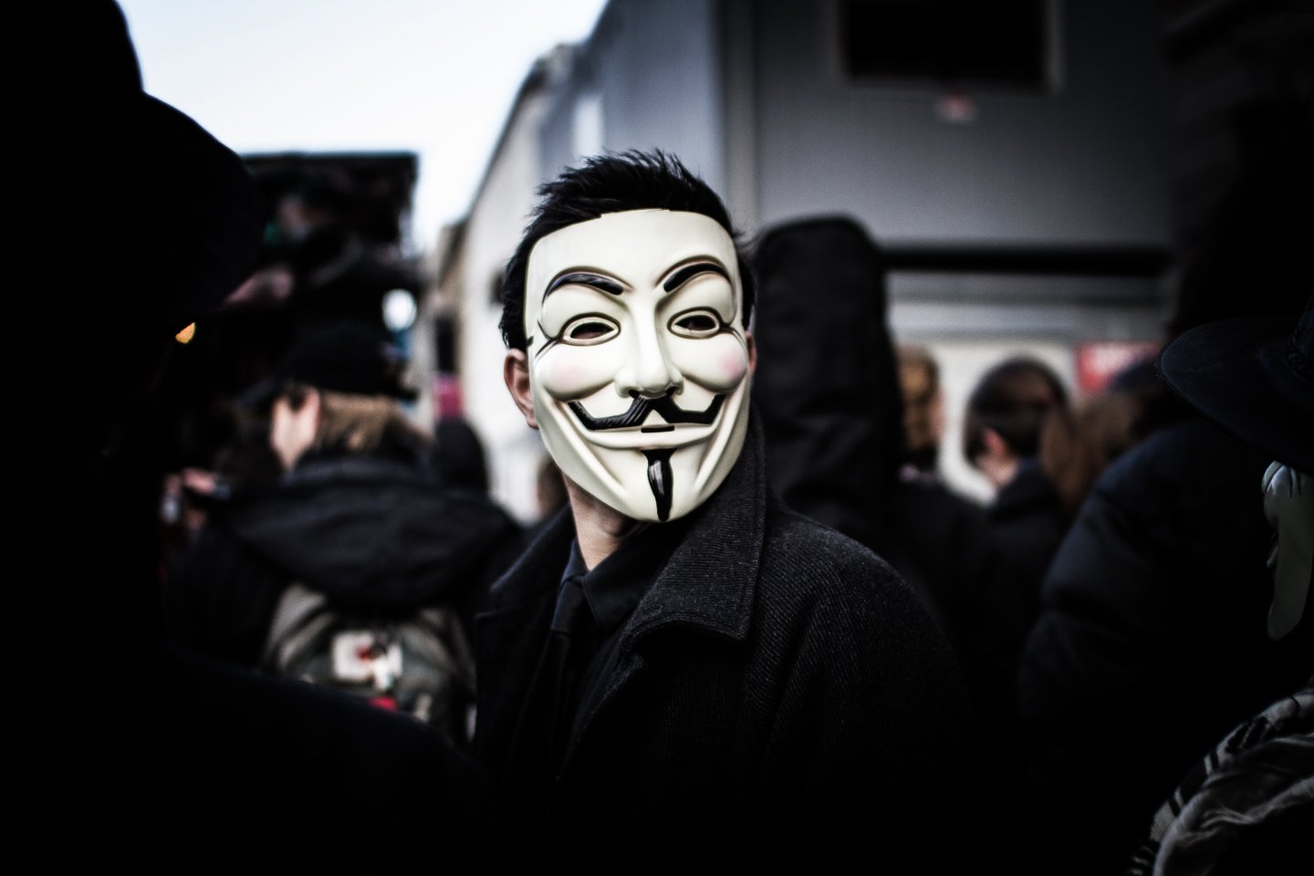 Person wears a Guy Fawkes mask which today is a trademark and symbol for the online hacktivist group Anonymous. 2012.