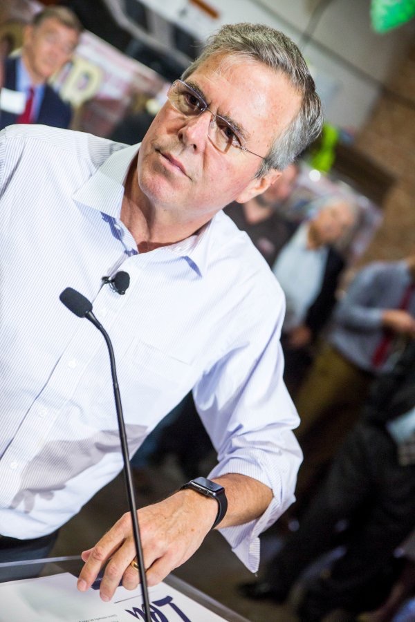 Former Florida Governor Jeb Bush speaks about his Apple Watch at a town hall meeting in Tempe, Arizona May 14, 2015.
