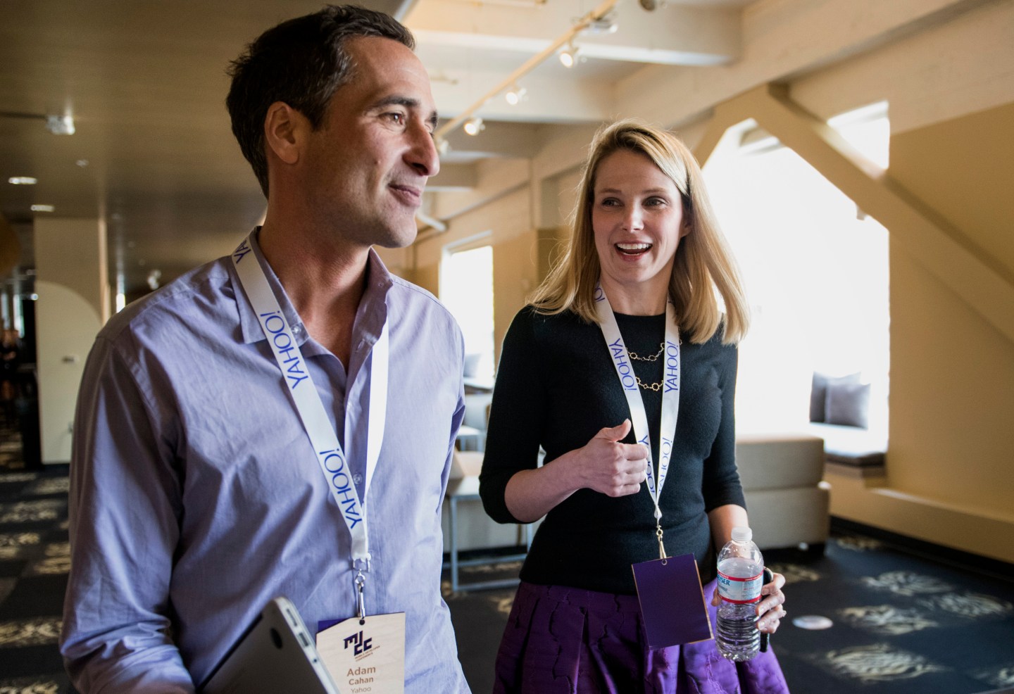 Marissa Mayer, president and chief executive officer at Yahoo! Inc., right, speaks with Adam Cahan, senior vice president of Mobile and Emerging Products, at Yahoo! as they leave a press conference at the Yahoo! Inc. Mobile Developer Conference in San Francisco, California, U.S., on Thursday, Feb. 19, 2015. The conference will unveil a new suite of services designed to help mobile developers better understand users, while improving, growing and monetizing their apps. Photographer: David Paul Morris/Bloomberg *** Local Caption *** Marissa Mayer;Adam Cahan