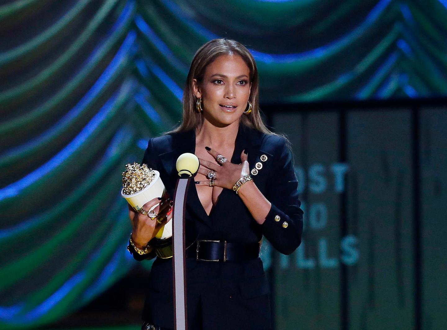 Jennifer Lopez accepts her award during the 2015 MTV Movie Awards in Los Angeles