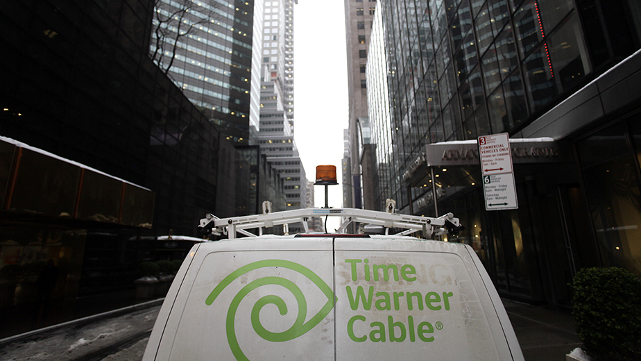 The Time Warner Cable logo is displayed on the back of a van in New York