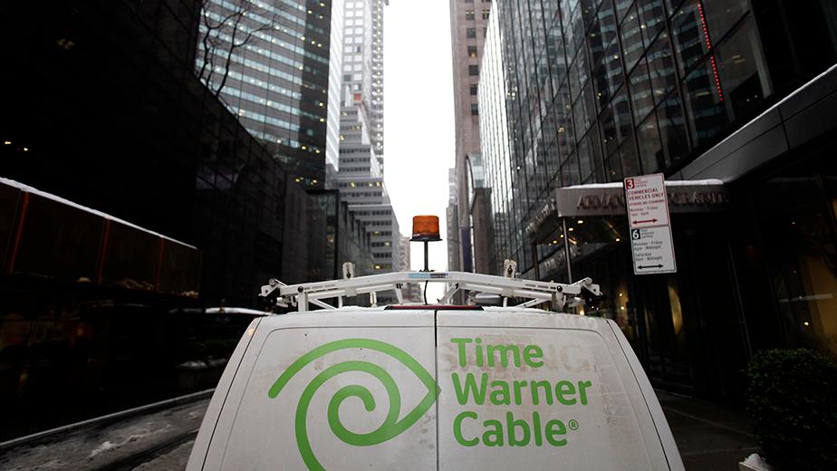 The Time Warner Cable logo is displayed on the back of a van in New York