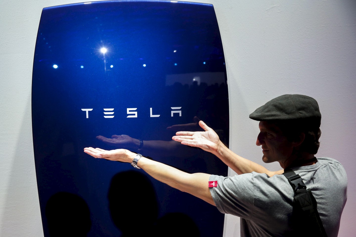 Attendees take pictures of the new Tesla Energy Powerwall Home Battery during an event at Tesla Motors in Hawthorne, California