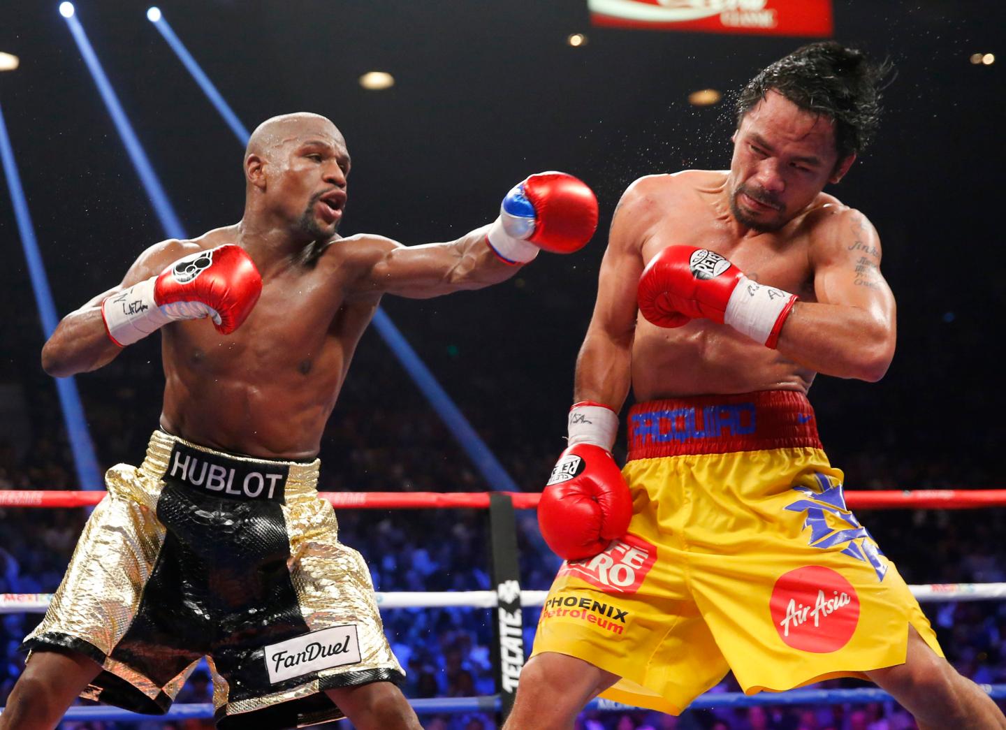 Mayweather, Jr. of the U.S. lands a left to the face of Pacquiao of the Philippines in the 11th round during their welterweight title fight in Las Vegas