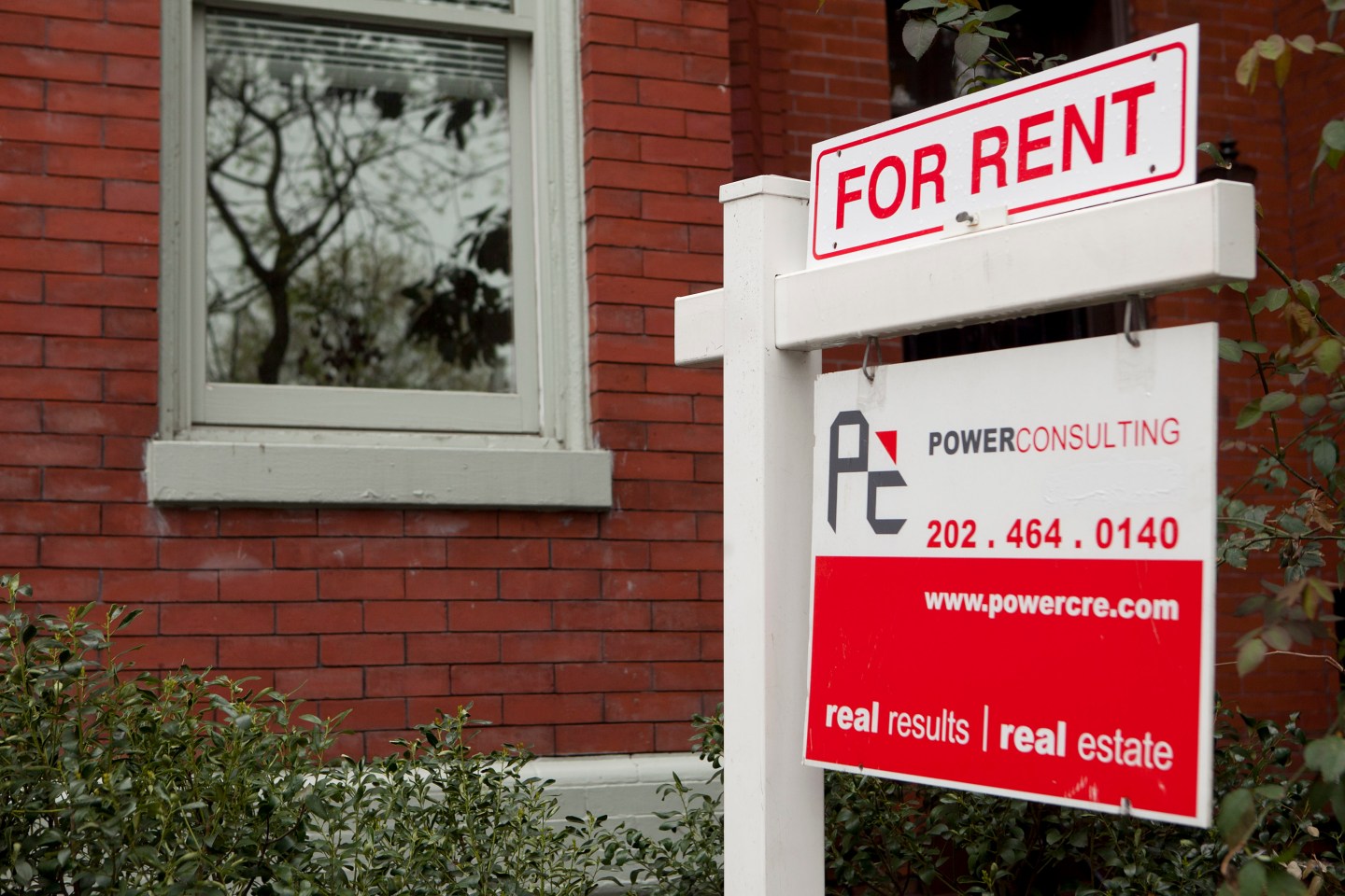 A rent sign stands in front of a row house in the Logan Circle neighborhood of Washington, D.C.
