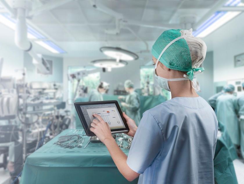 Surgeon using tablet
