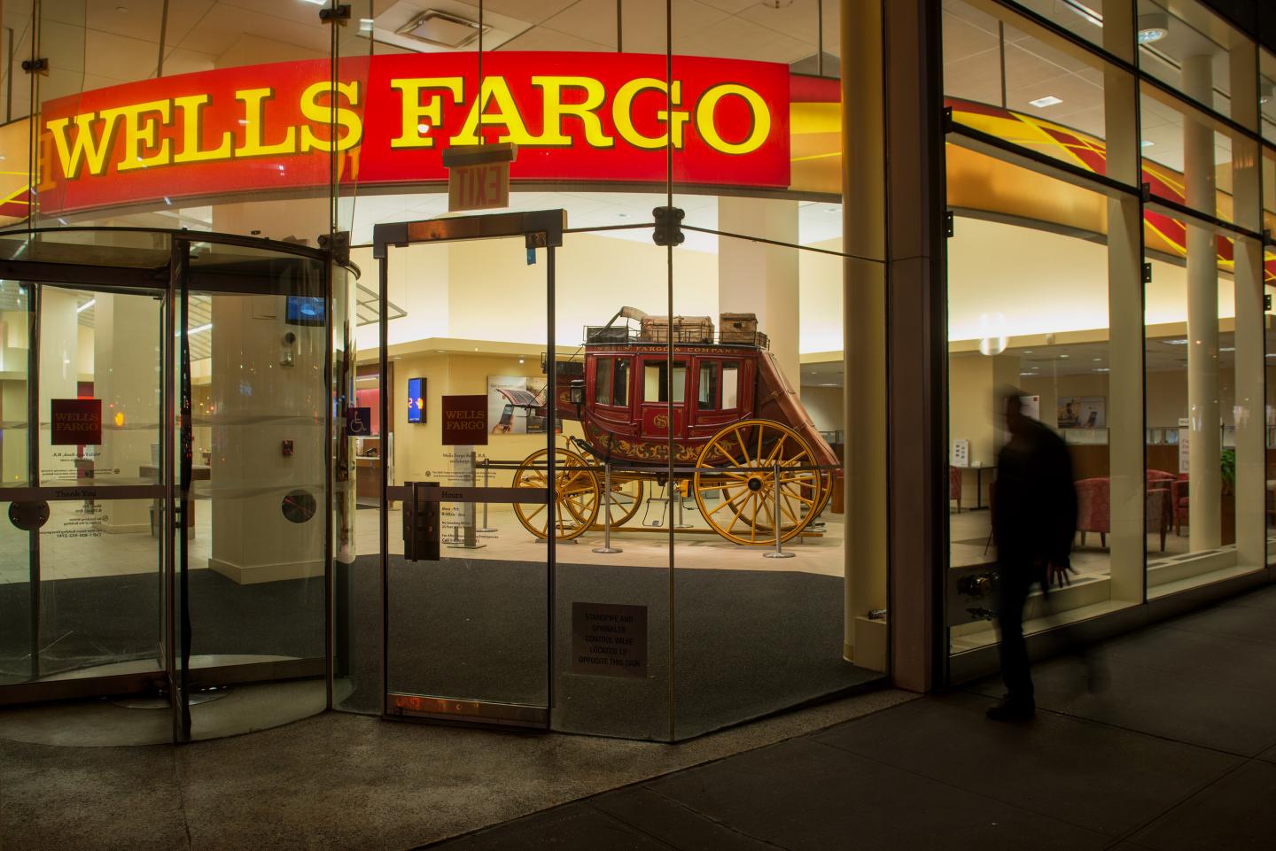 A Wells Fargo bank branch on Madison Avenue in Midtown Manhattan,  New York, U.S., on Saturday, April 11, 2015.  Photographer: Craig Warga/Bloomberg *** Local Caption ***