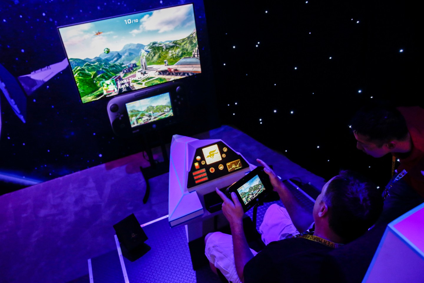 An attendee plays the Star Fox Zero video game from Nintendo Co. during the E3 Electronic Entertainment Expo in Los Angeles, California, U.S., on Tuesday, June 16, 2015. E3, a trade show for computer and video games, draws professionals to experience the future of interactive entertainment as well as to see new technologies and never-before-seen products. Photographer: Patrick T. Fallon/Bloomberg