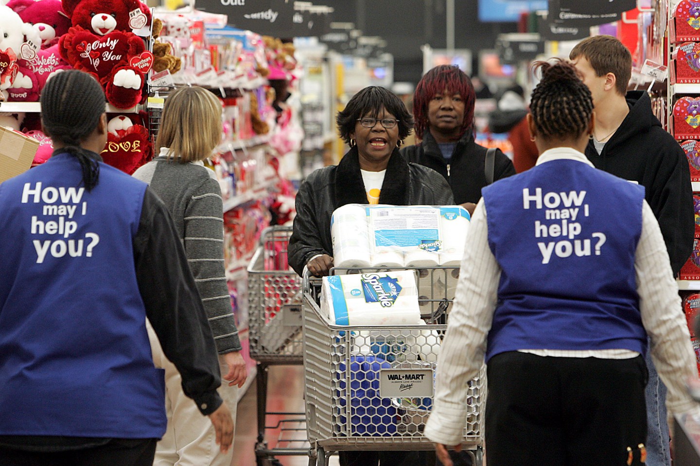 Phyllis McCrary, center, talks to store greeters while shopp