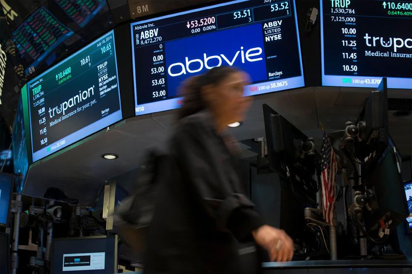 A screen displays the share price for pharmaceutical maker AbbVie on the floor of the New York Stock Exchange