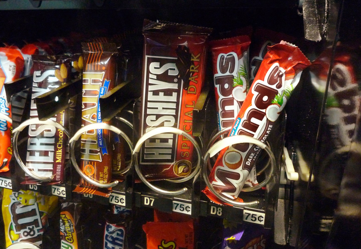 A row of candy bars manufactured by Hershey is seen in a vending machine in Washington