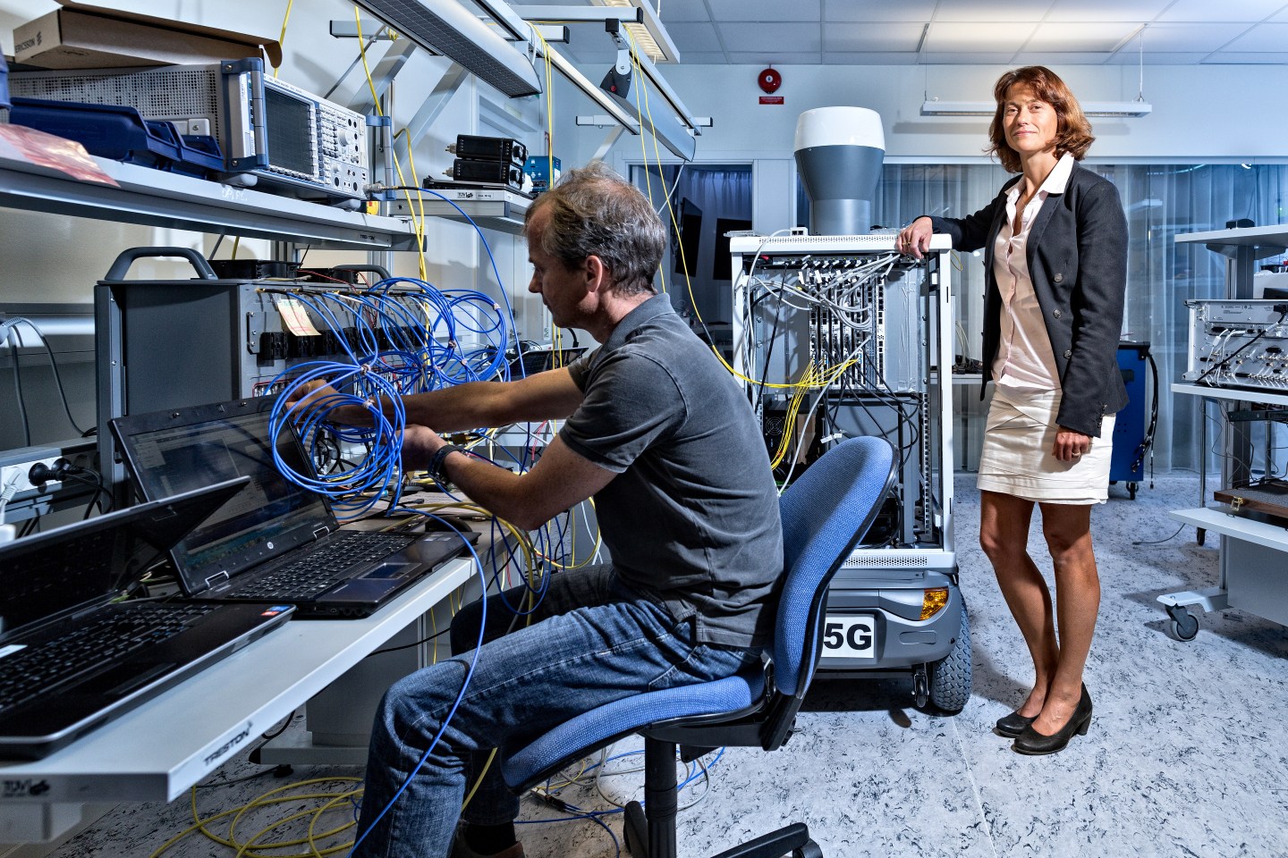 Ericsson vice president Sara Mazur poses next to the 5G device