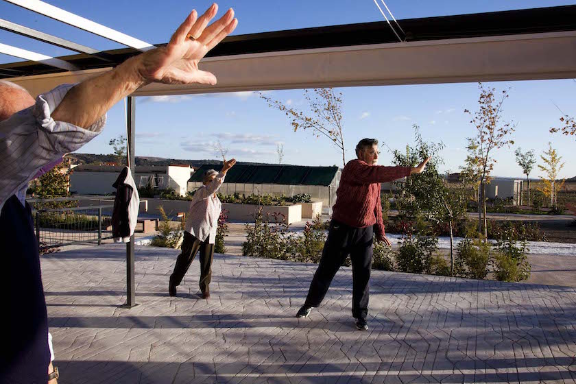 Residents of Spain's Trabensol senior housing cooperative exercise at one of the facility's common areas.