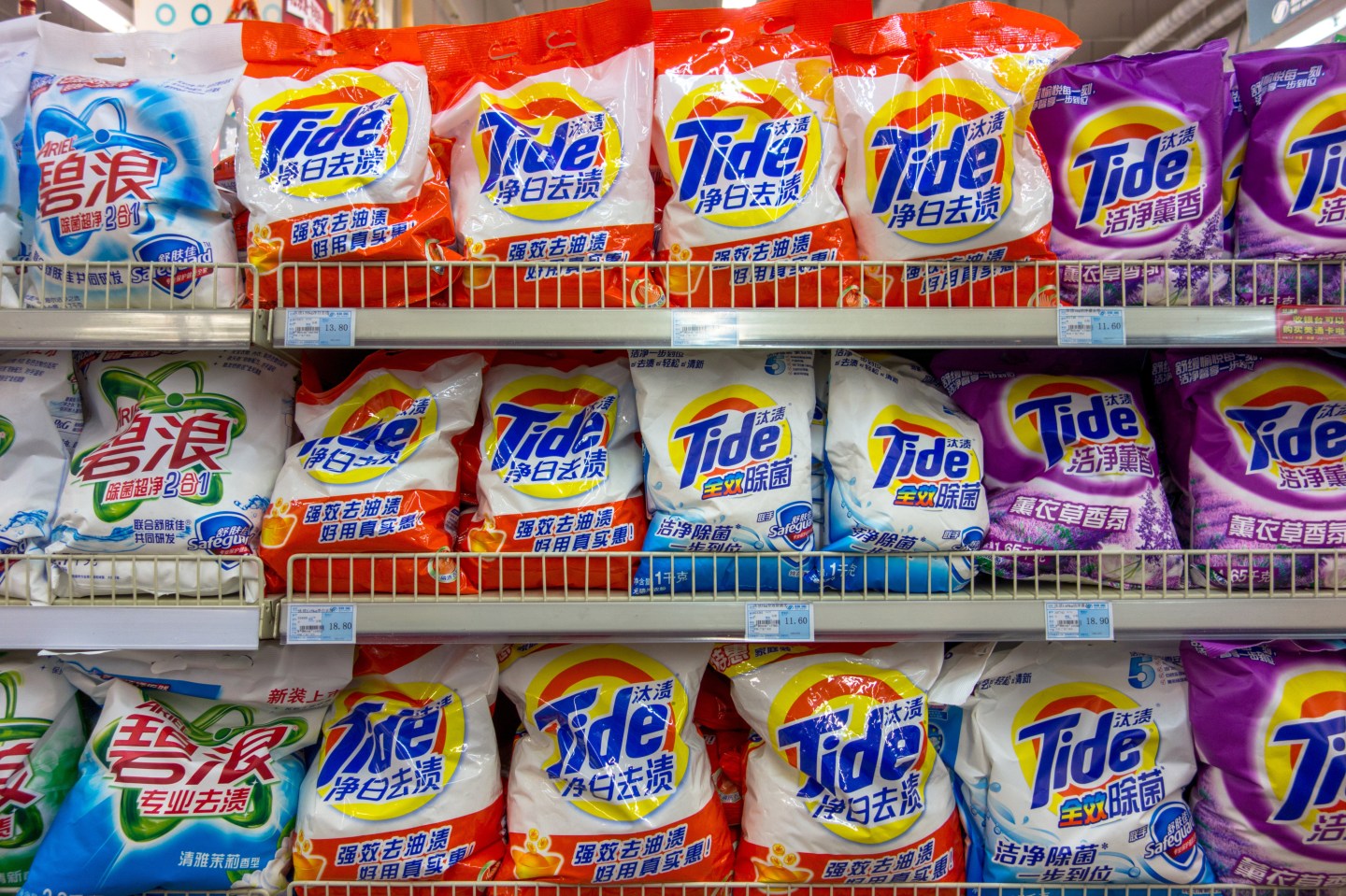 Tide and Arial laundry powder on the shelves in a Chinese