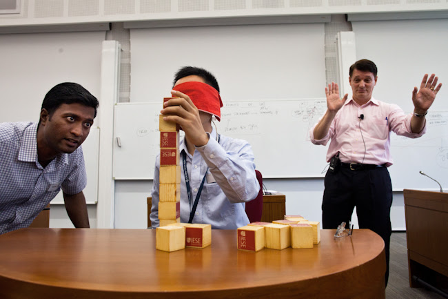 CEIBS professor Pablo Cardona oversees a block-balancing exercise during the boot camp.