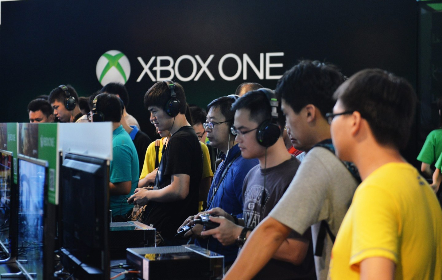 Visitors experience the Xbox One game during the China Joy event on July 31, 2014 in Shanghai, China.