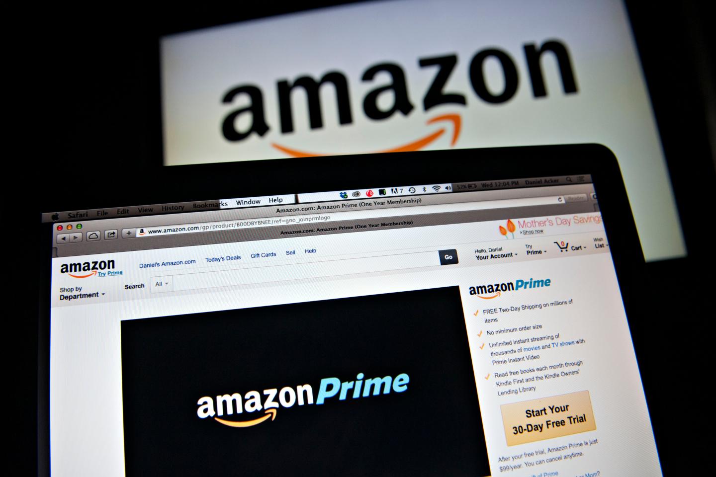 Amazon's Prime logo is displayed on computer screens.