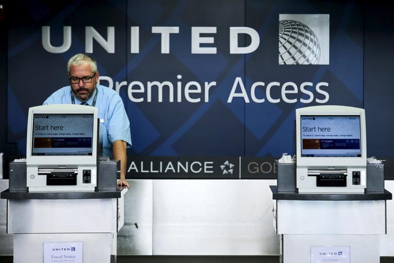 A United Airlines worker checks computers in their counters at the Newark Liberty International Airport in New Jersey