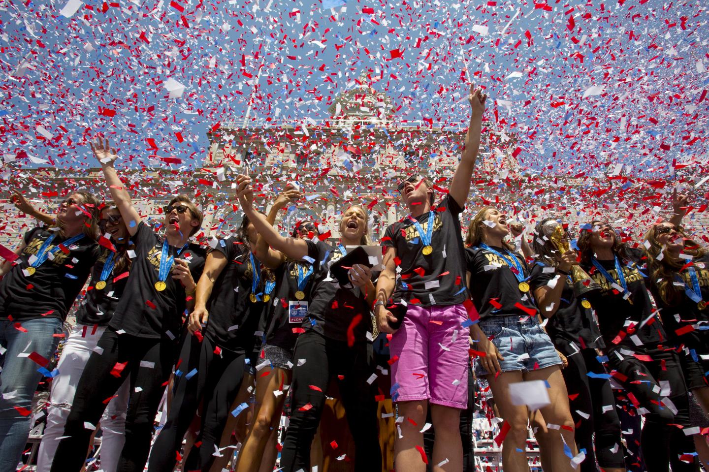 The U.S. women's soccer team cheer during a reception at New York City Hall to celebrate their World Cup final win over Japan, in New York
