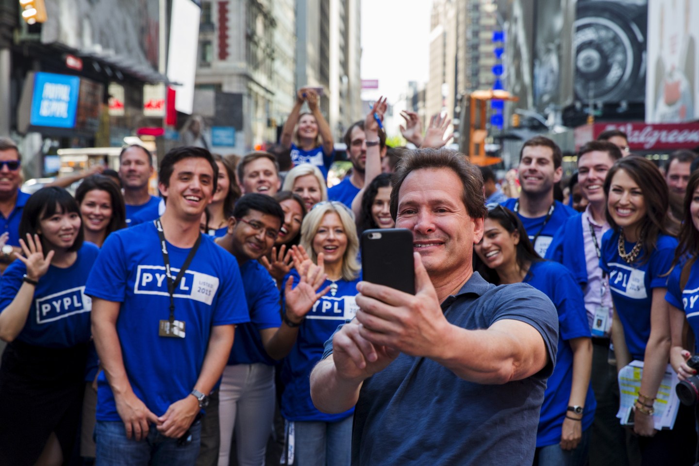 Paypal CEO Dan Schulman celebrates with employees after the company's relisting on the Nasdaq in New York