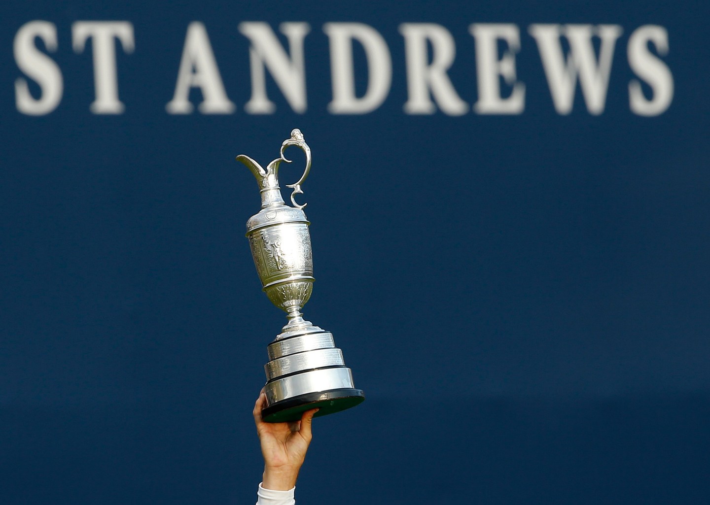 Johnson of the U.S. celebrates as he holds the Claret Jug after winning the British Open golf championship on the Old Course in St. Andrews, Scotland