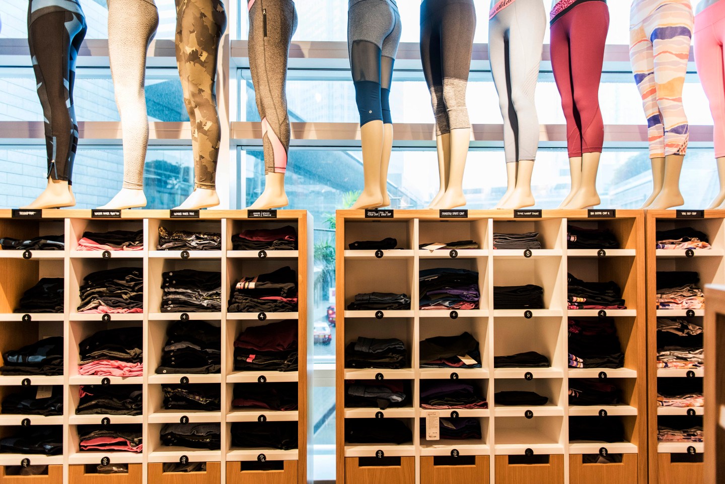 Athletic apparel sits on display inside a Lululemon Athletica Inc. store at International Finance Centre mall in Hong Kong, China, on Monday, June 22, 2015. Lululemon Athletica opened their first retail store in Hong Kong on June 19. Photographer: Xaume Olleros/Bloomberg