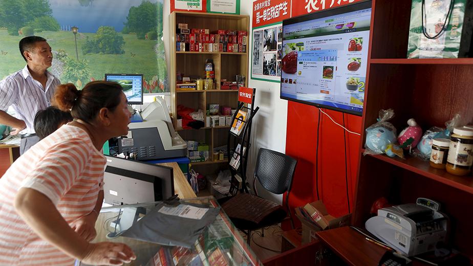 Customer shops at an Alibaba rural service centre in Jinjia Village, Tonglu, Zhejiang province, China