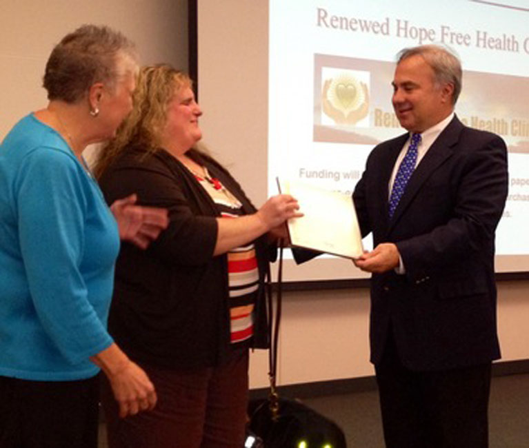 Perrigo CEO Joe Papa, right, at a charity event in 2013.