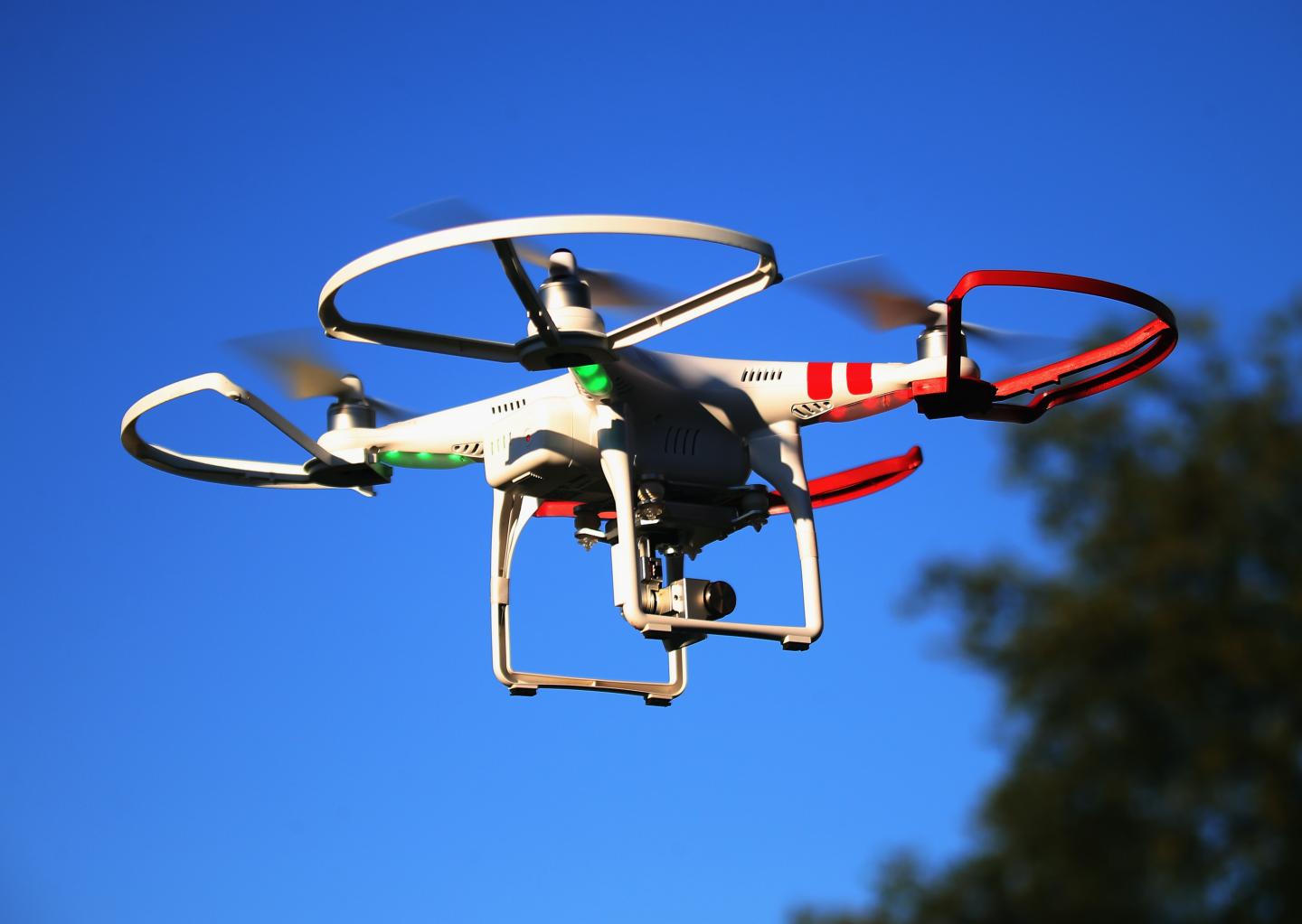 A drone is flown for recreational purposes in the sky above Old Bethpage, New York on September 5, 2015.