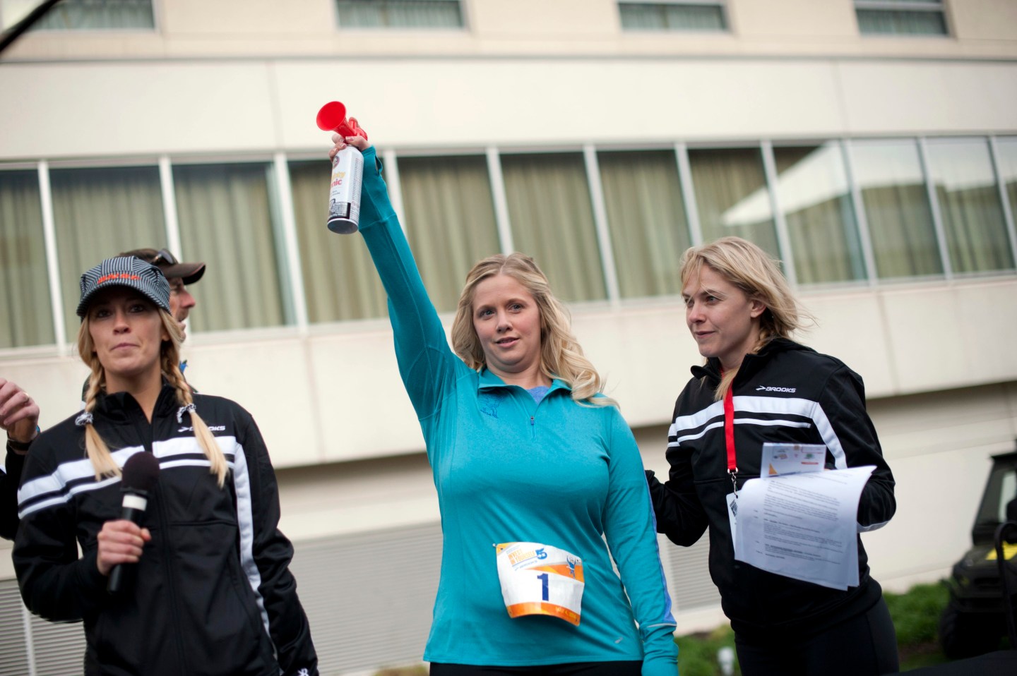 Warren Buffett protégé Tracy Britt Cool blasts an air-horn to start the 'Berkshire Hathaway Invest In Yourself 5K' race in May, 2014.