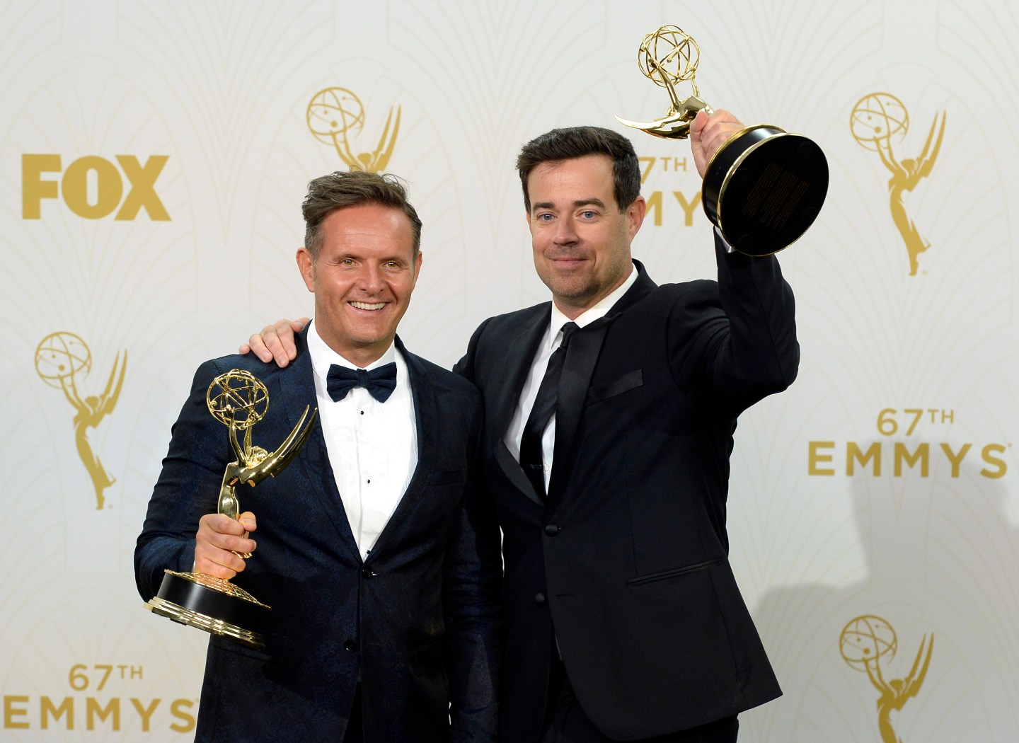 LOS ANGELES, CA - SEPTEMBER 20: Producer Mark Burnett (L) and TV personality Carson Daly, winners of Outstanding Reality-Competition Program for 'The Voice', pose in the press room at the 67th Annual Primetime Emmy Awards at Microsoft Theater on September 20, 2015 in Los Angeles, California. (Photo by Kevork Djansezian/Getty Images)