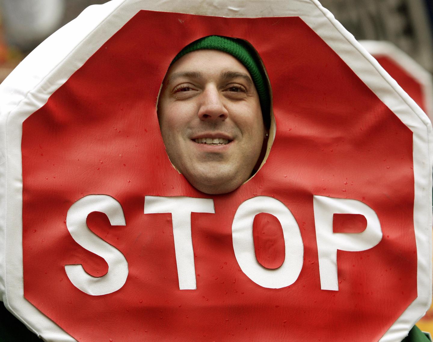 A parade marcher wearing a Stop Sign cos