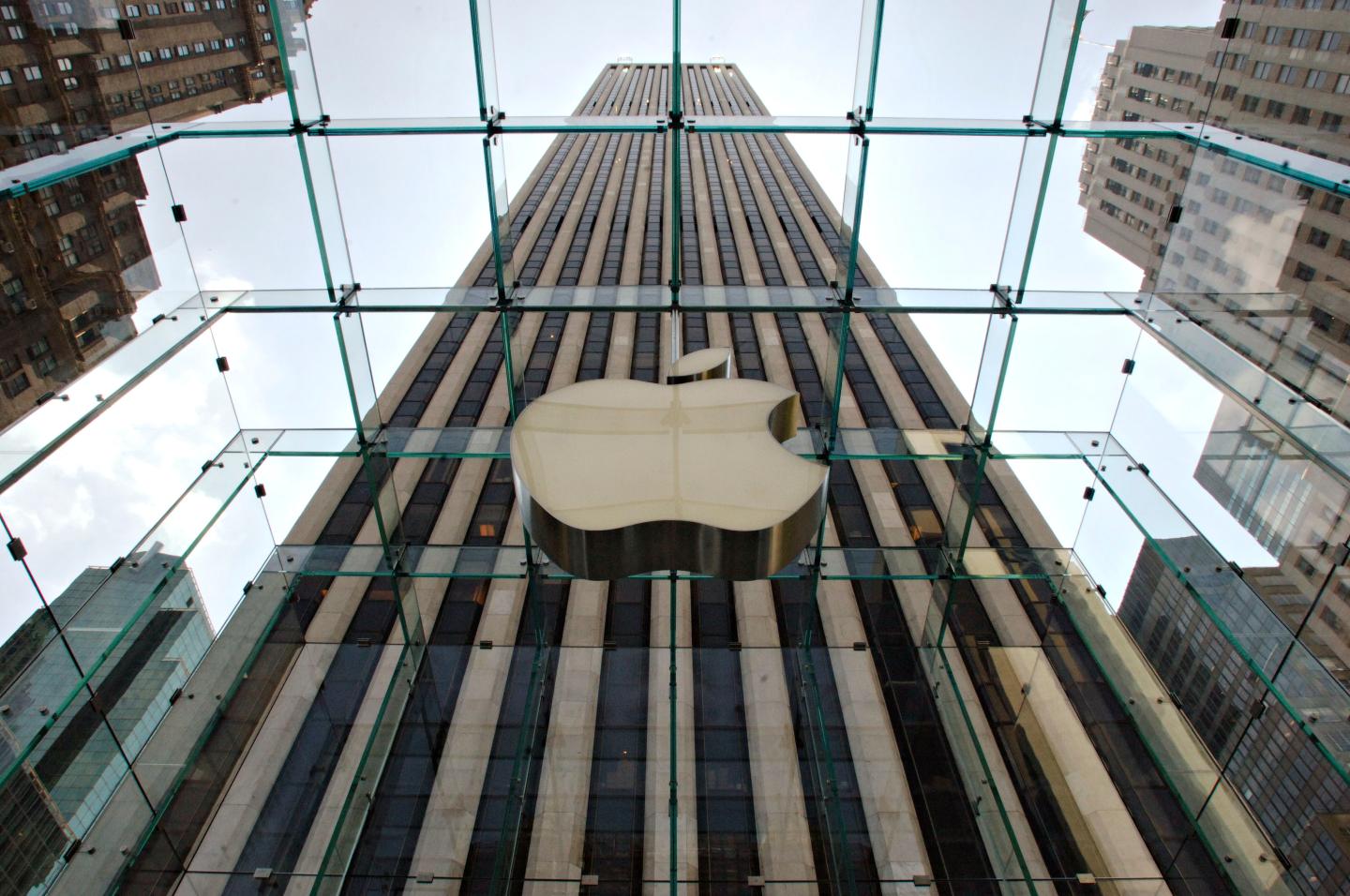 An Apple Computer Inc. logo hangs in the center of a clear g