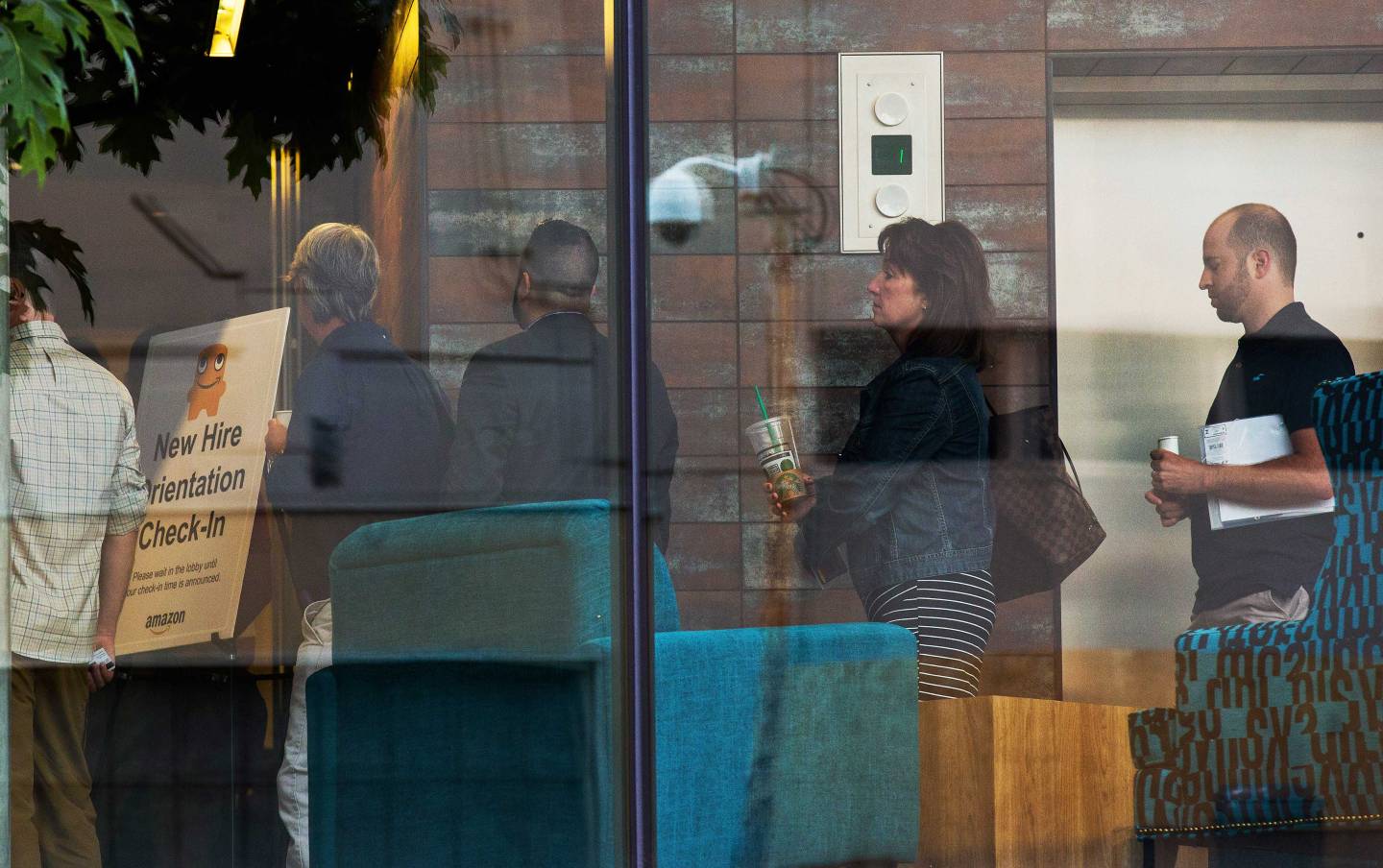 New Amazon employees line up for orientation, on the retailer?s campus in Seattle.