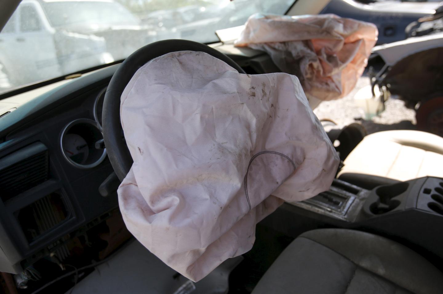A deployed Takata manufactured airbag is seen on the driver's side of a 2007 Dodge Charger vehicle at a recycled auto parts lot in Detroit