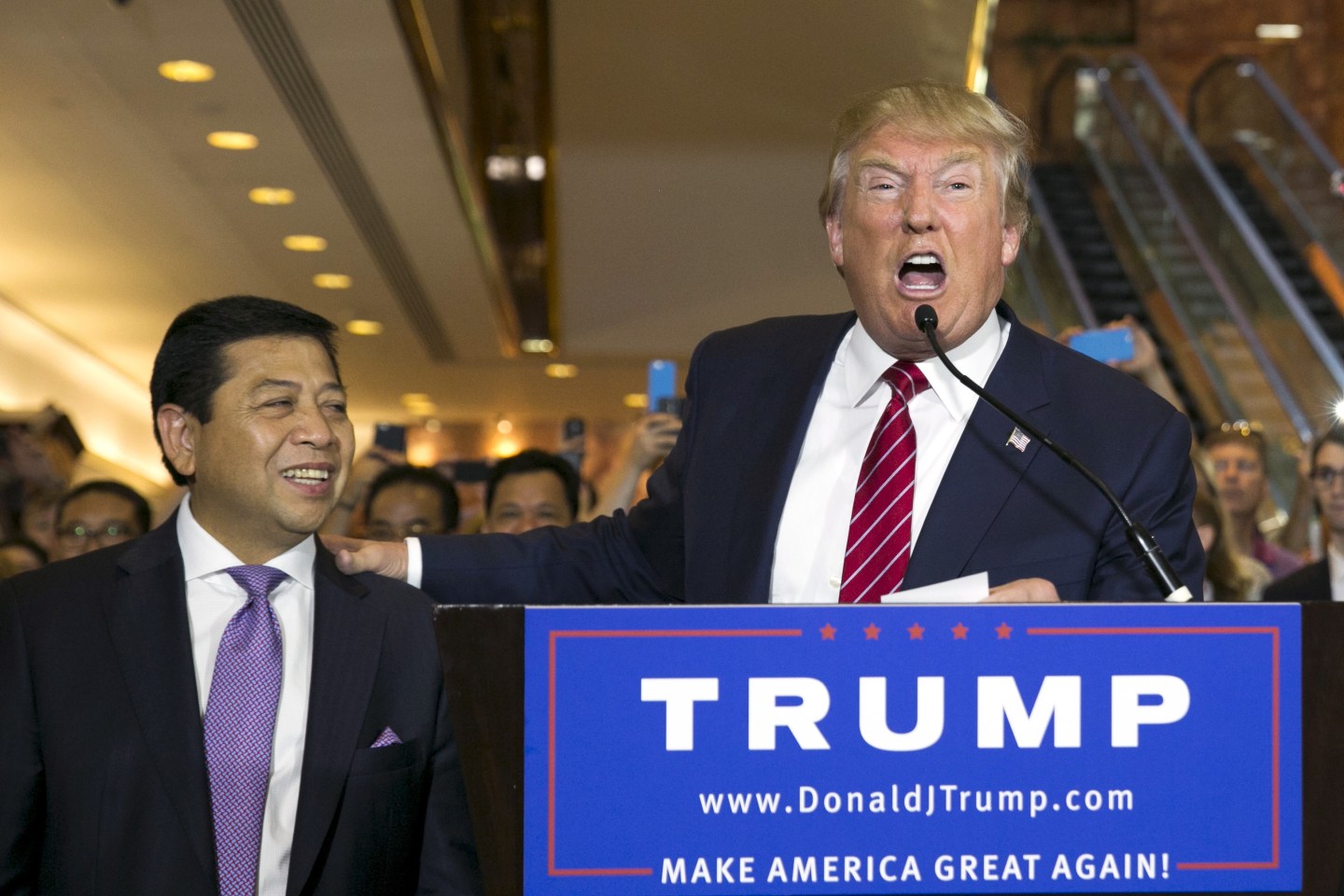 U.S. presidential hopeful Donald Trump (R) stands with Setya Novanto, Speaker of the House of Representatives of Indonesia, following a press availability after signing a pledge with the RNC at Trump Tower in Manhattan, New York