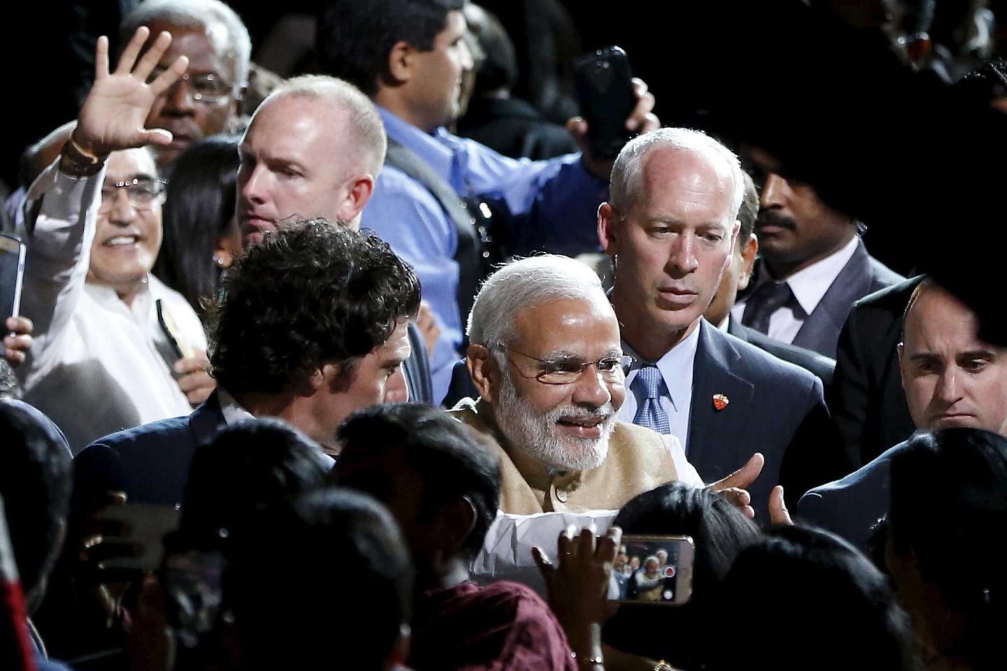 Indian PM Modi shakes hands with the crowd after speaking at a community reception at SAP Center in San Jose, California