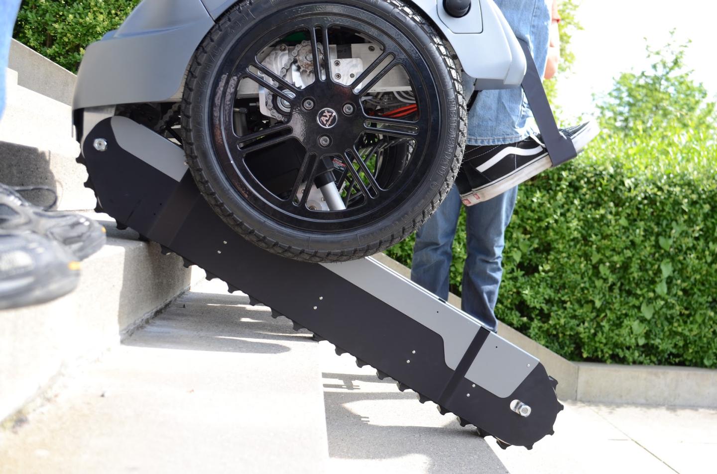 This wheelchair is like a Segway crossed with a tank, and it can climb stairs