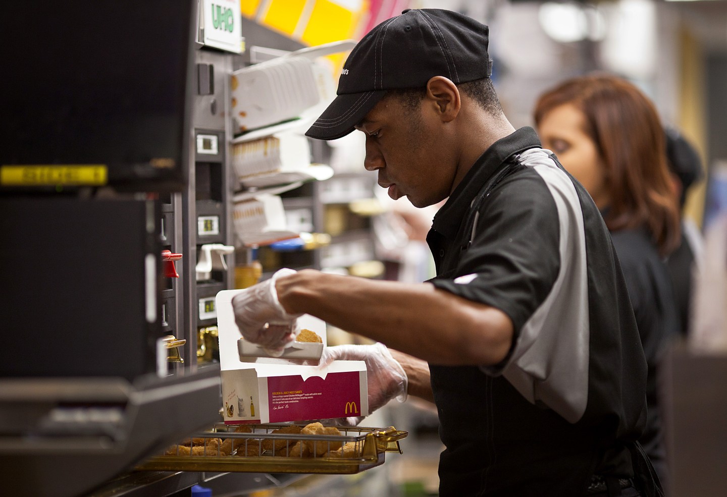 A worker puts together an order of Chicken McNuggets at a McDonald's Corp. restaurant in Little Falls, New Jersey, U.S.