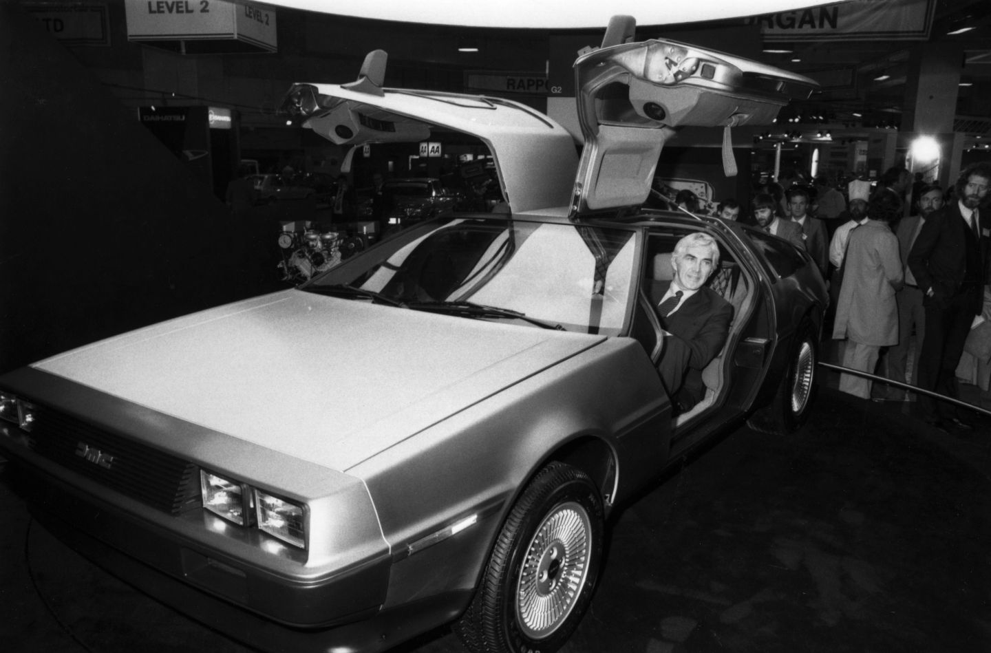 John DeLorean seated in one of his futuristic gull-wing DeLorean DMC-12 sports cars which are being exhibited at Earls Court, London on Oct. 21, 1981.