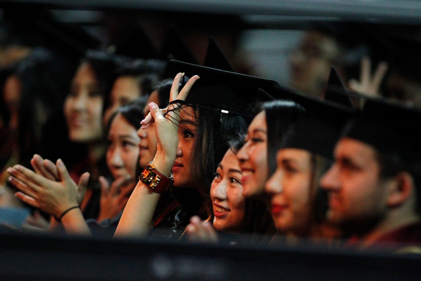 LOS ANGELES, CA.-MAY 16, 2014: USC Marshall School of Business graduates cheer after listening to t