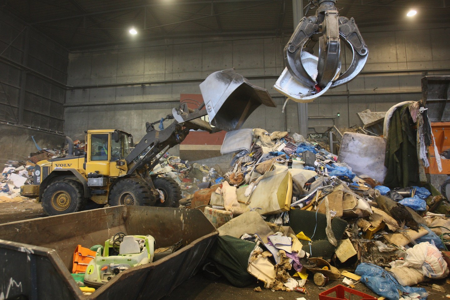 Crews sort garbage at a processing center in Nuemuenster, Germany for consumption in the city's converted power plant.