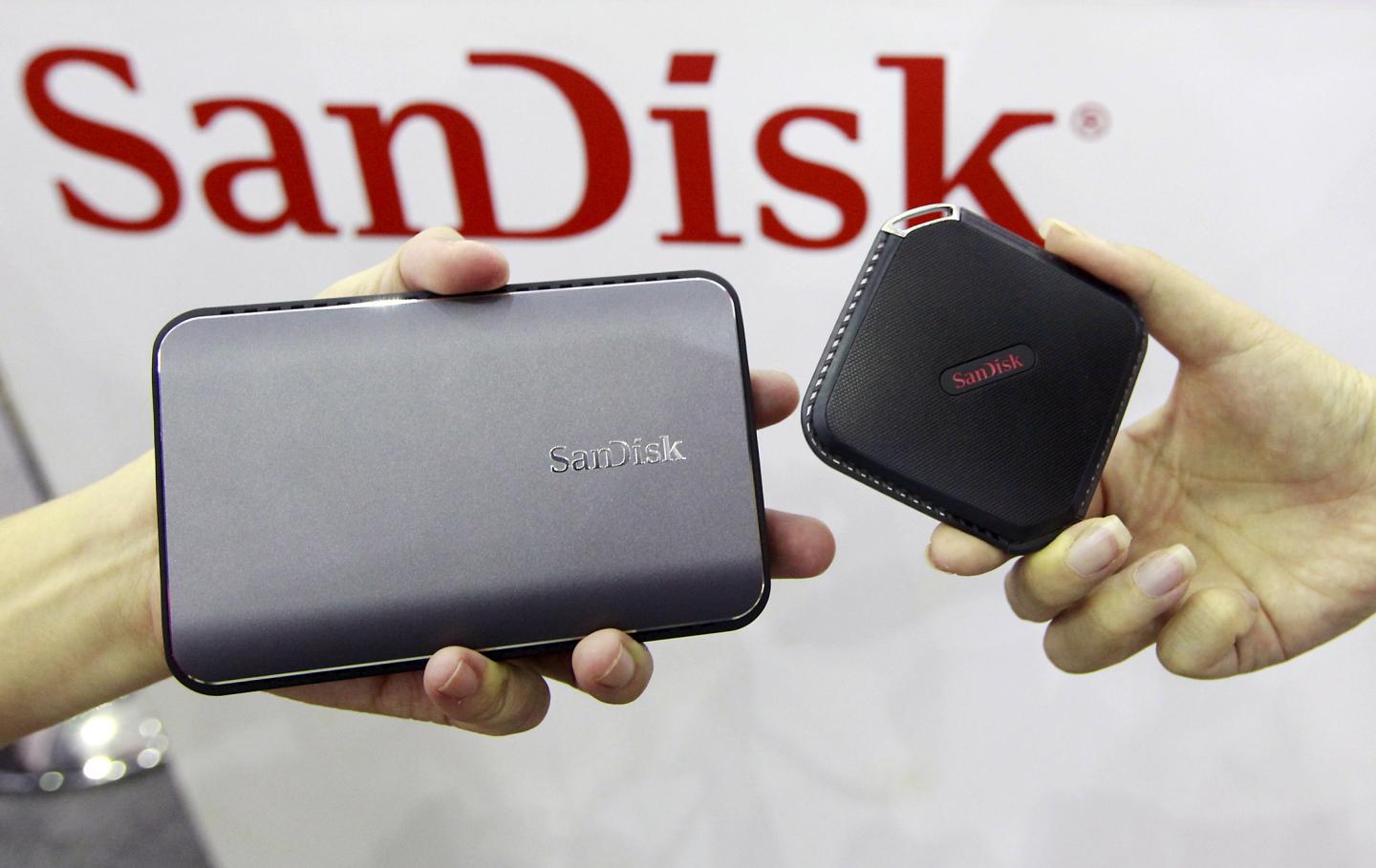 Sandisk's new portable solid state drives are displayed at the Sandisk booth during the 2015 Computex exhibition at the TWTC Nangang exhibition hall in Taipei, Taiwan