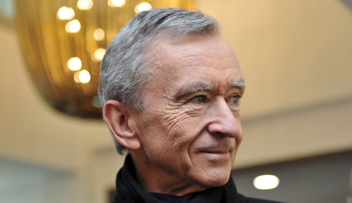 French luxury group LVMH Chairman and CEO Bernard Arnault attends the inaugural visit of the French prime minister to the Guerlain production centre "La Ruche" in Chartres, central France, on February 6, 2015. AFP PHOTO / GUILLAUME SOUVANT (Photo credit should read GUILLAUME SOUVANT/AFP/Getty Images)